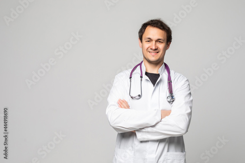 healthcare, profession and medicine concept. Smiling male doctor in white coat over white background