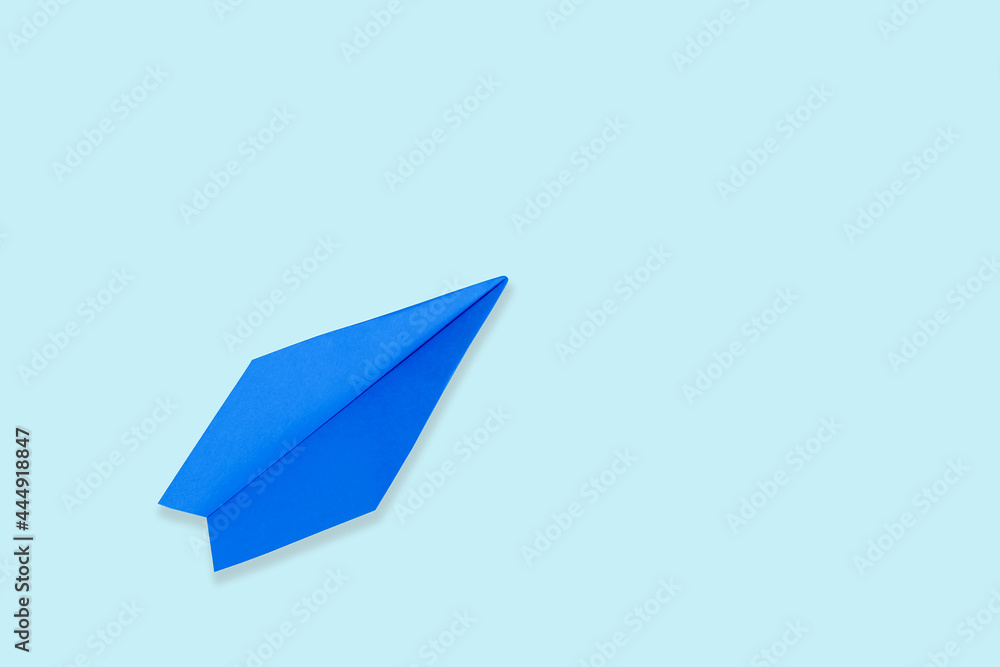 blue paper airplane, on a blue background blue paper airplane, on a blue background