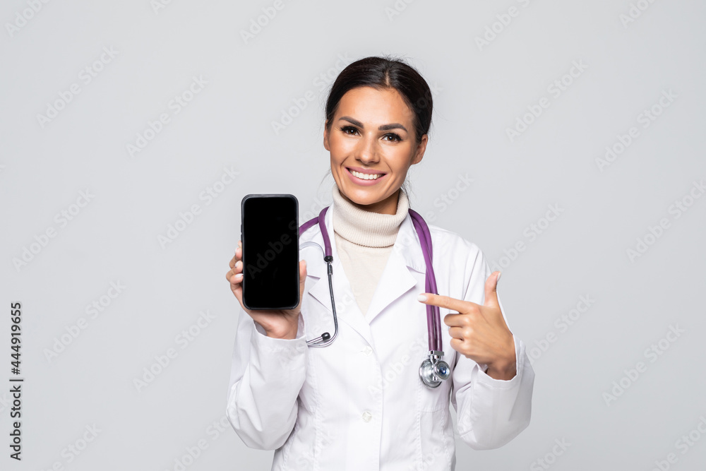 Young doctor woman pointing on cellphone screen Young doctor woman pointing on cellphone screen