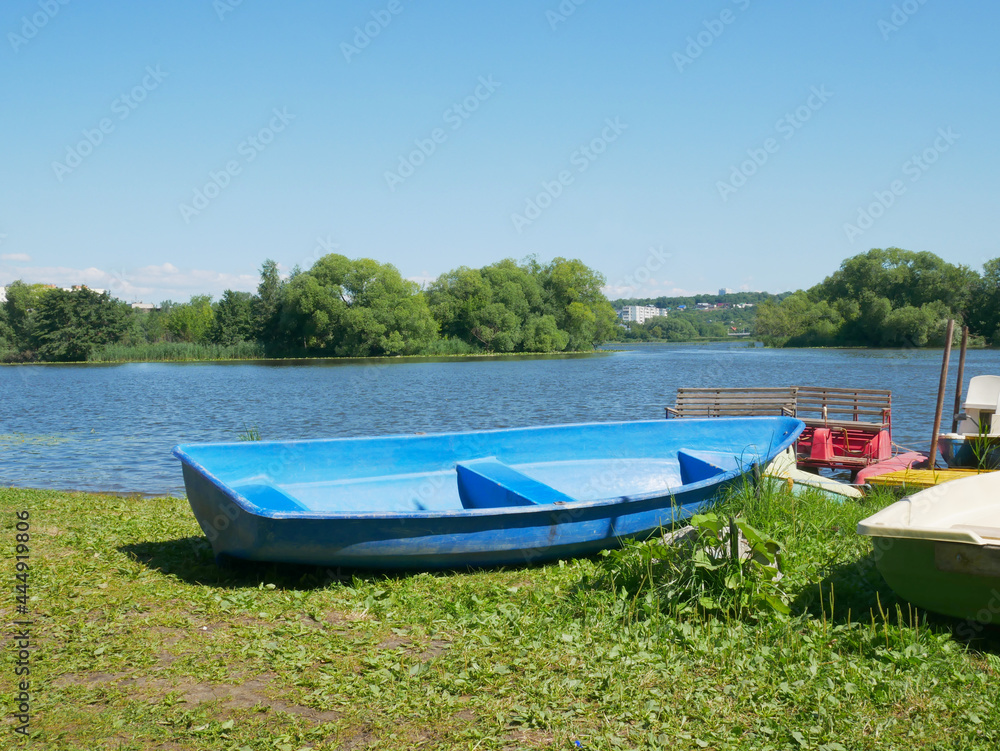 Blue boat on the river bank
