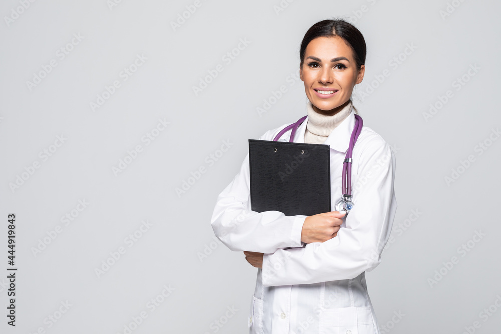 Young doctor with stethoscope and clipboard isolated on white background Young doctor with stethoscope and clipboard isolated on white background