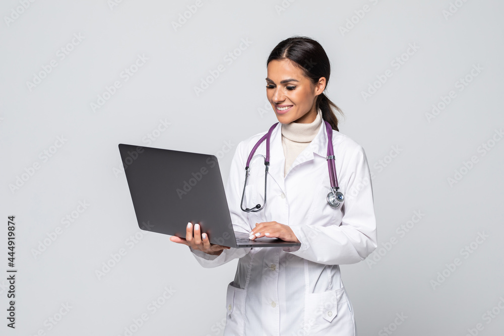 Doctor with laptop computer isolated on white background. Doctor with laptop computer isolated on white background.