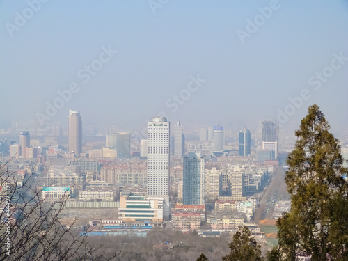 Low visibility in the city caused by severe air pollution in Jinan, China