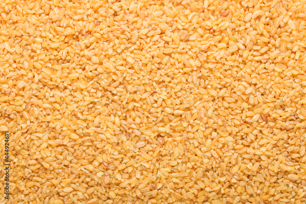 Raw bulgur food background. Dry bulgur grain. Healthy eating. Organic product. Top view. Raw bulgur food background. Dry bulgur grain. Healthy eating. Organic product. Top view.