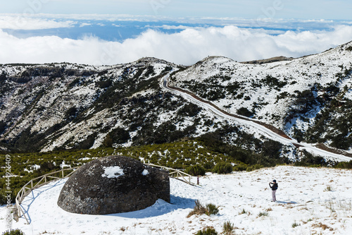 Obraz na plátně Adult male taking pictures to Poco da Neve at Pico do Areeiro mountain covered with snow in Madeira island, Portugal