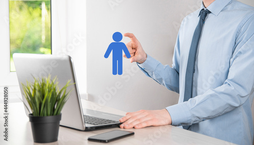 Businessman holds man person icon on dark tone background.HR Human ,people iconTechnology Process System Business with Recruitment, Hiring, Team Building. Organisation structure concept