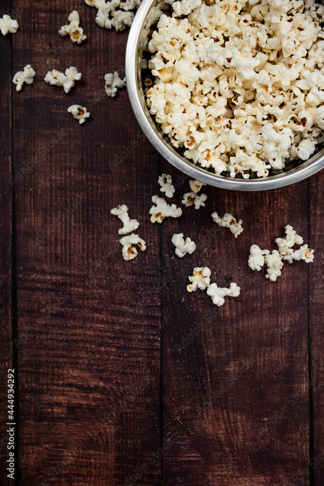 Salted Pop Corn In Bowl on wooden table Salted Pop Corn In Bowl on wooden table
