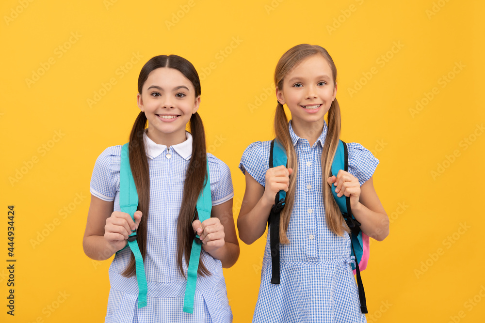 Happy children back to school on Knowledge day September 1 yellow background, childhood Happy children back to school on Knowledge day September 1 yellow background, childhood
