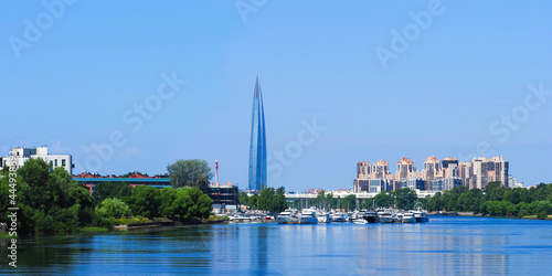 Panoramic summer cityscape, yacht club in the Krestovsky Island and residential areas in Saint Petersburg, Russia. Skyscraper Lakhta center on the shore of the Gulf of Finland