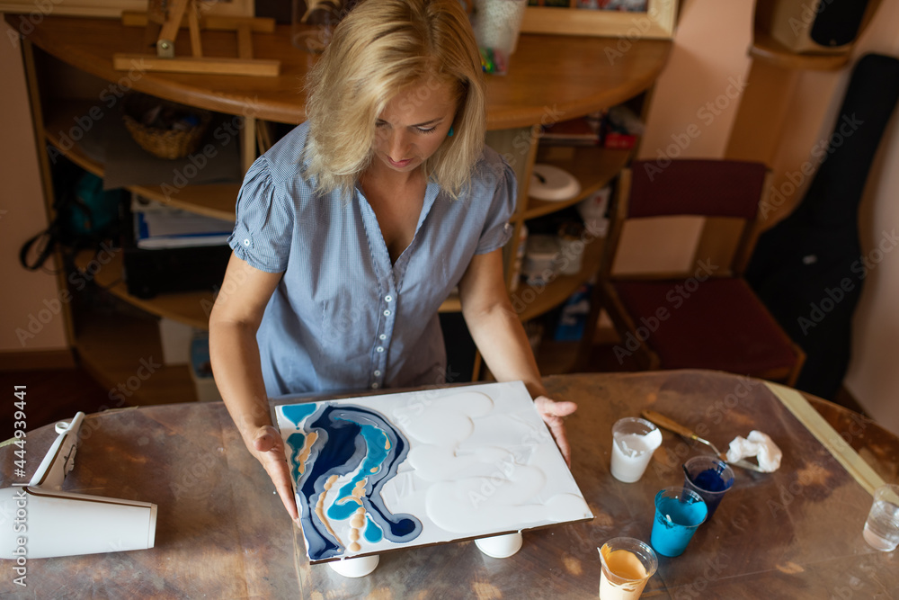 Fototapeta premium artist do interior painting. Happiness and creativity. Painting in interior. Hobbies and crafts. Learning to draw. Work at home.