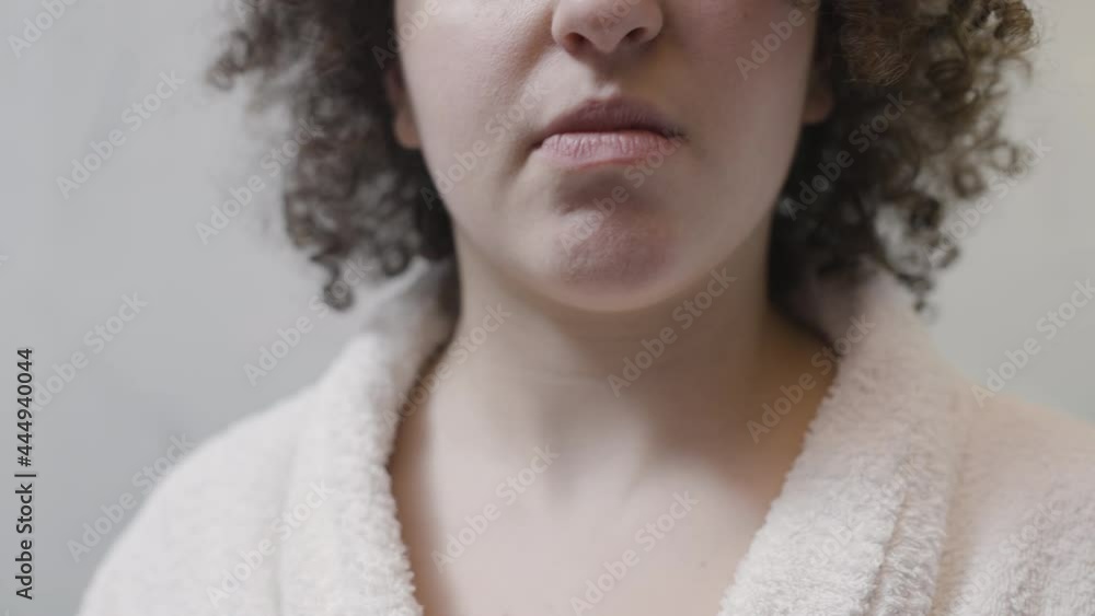 Woman experiencing acute toothache, carefully touching cheek, unhappy morning 