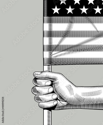 Vintage engraving of hand holding the flag of USA