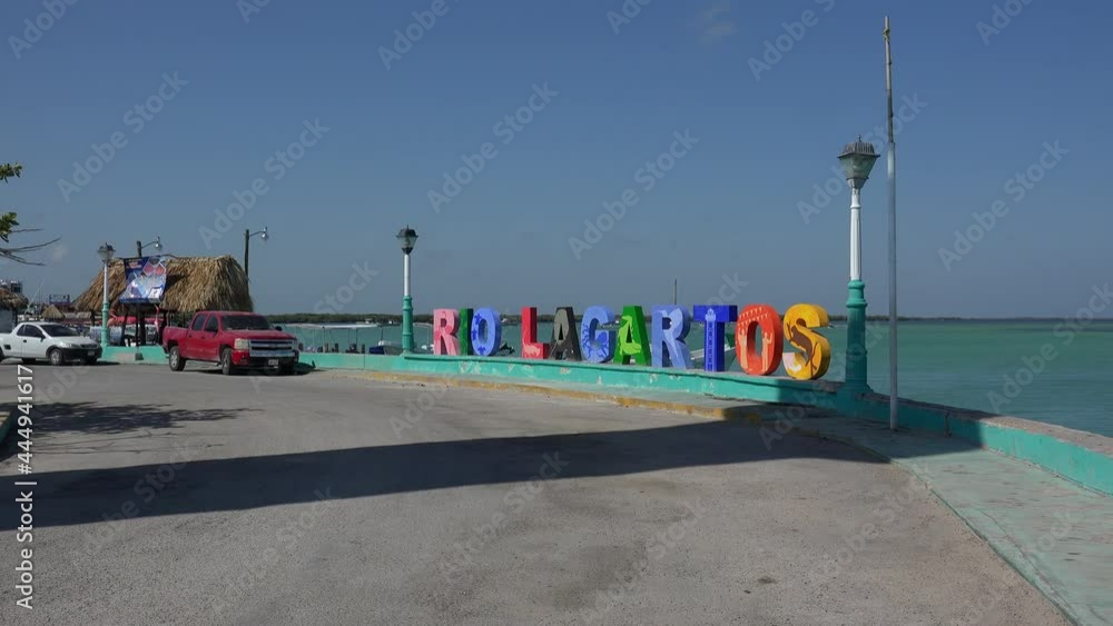 'Rio Lagartos' sign at the town waterfront. Rio Lagartos, Yucatan, Mexico 'Rio Lagartos' sign at the town waterfront. Rio Lagartos, Yucatan, Mexico