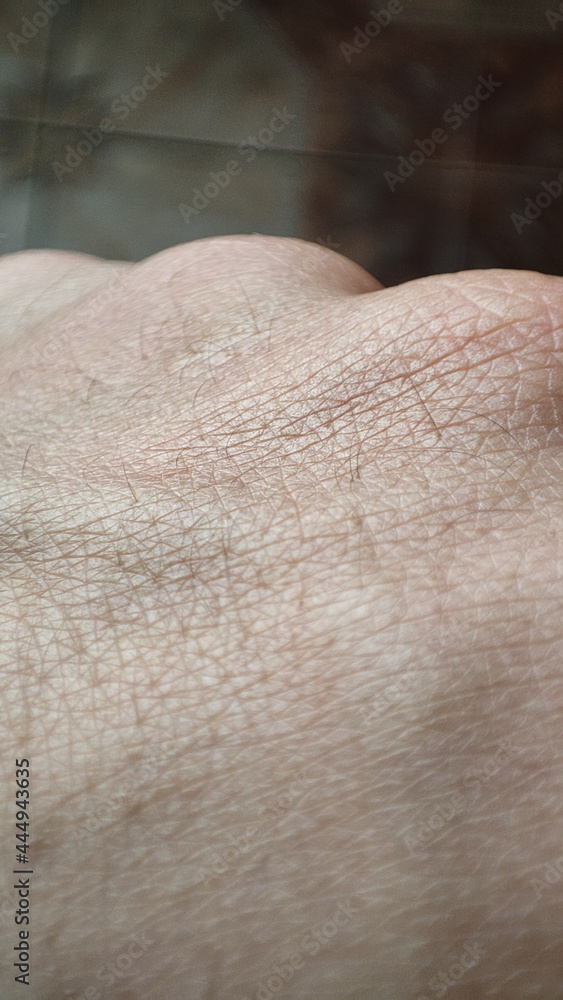 Fototapeta premium macro skin of human hand. Medicine and dermatology concept. healthy brown caucasian skin. Close up detail of skin