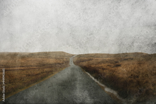 Φωτογραφία Looking through a car windscreen out onto a mountain road going across bleak moorland on a wet stormy day