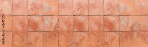 Panorama of brown terra cotta floor tiles outside the building pattern and background seamless photo