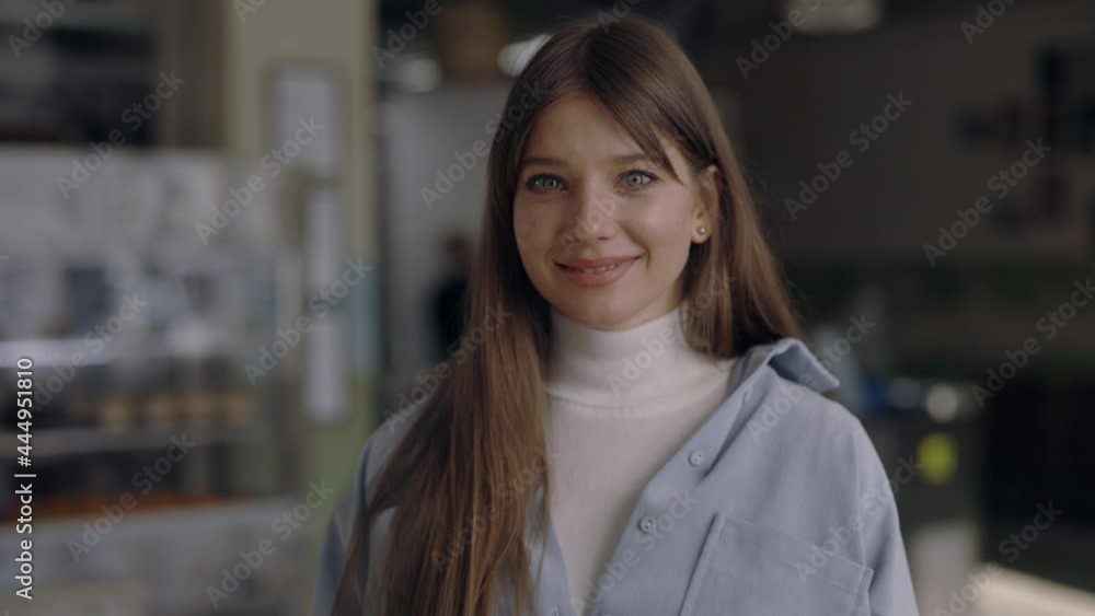 Smiling cafe owner with blue eyes posing at work Smiling cafe owner with blue eyes posing at work