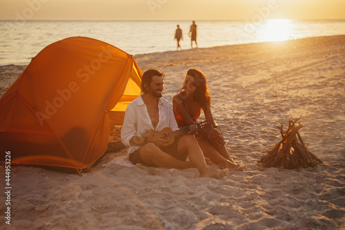 Romantic Couple Near a Tent on the Beach