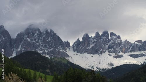 Wallpaper Mural Dark, evil looking and cinematic mountain range in the Dolomites, Italy. Panning shot close up of epic Odle mountains with rocky and snowy peaks. Concept of adventure and wanderlust. 4K. Torontodigital.ca