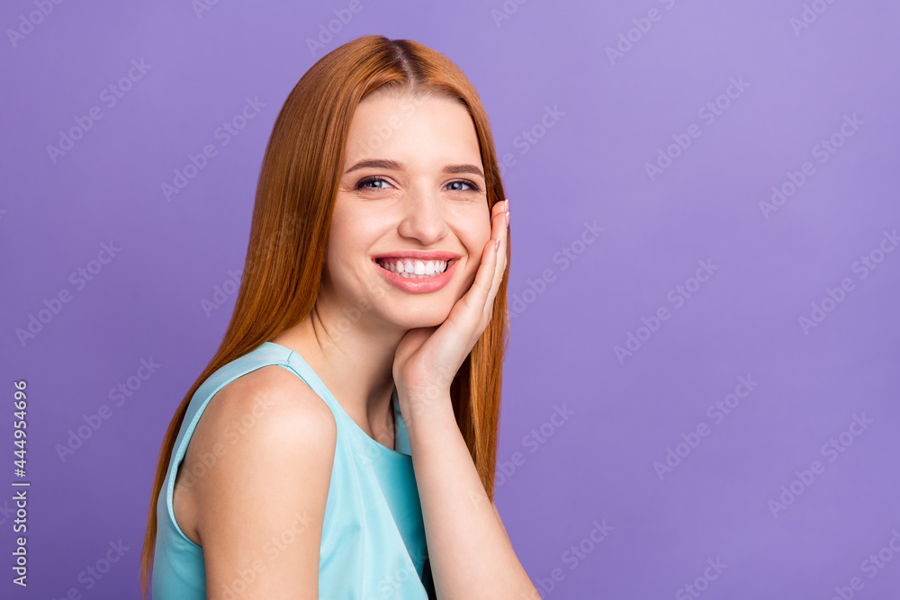 Photo of charming happy lovely young woman hold hand cheek good mood isolated on purple color background