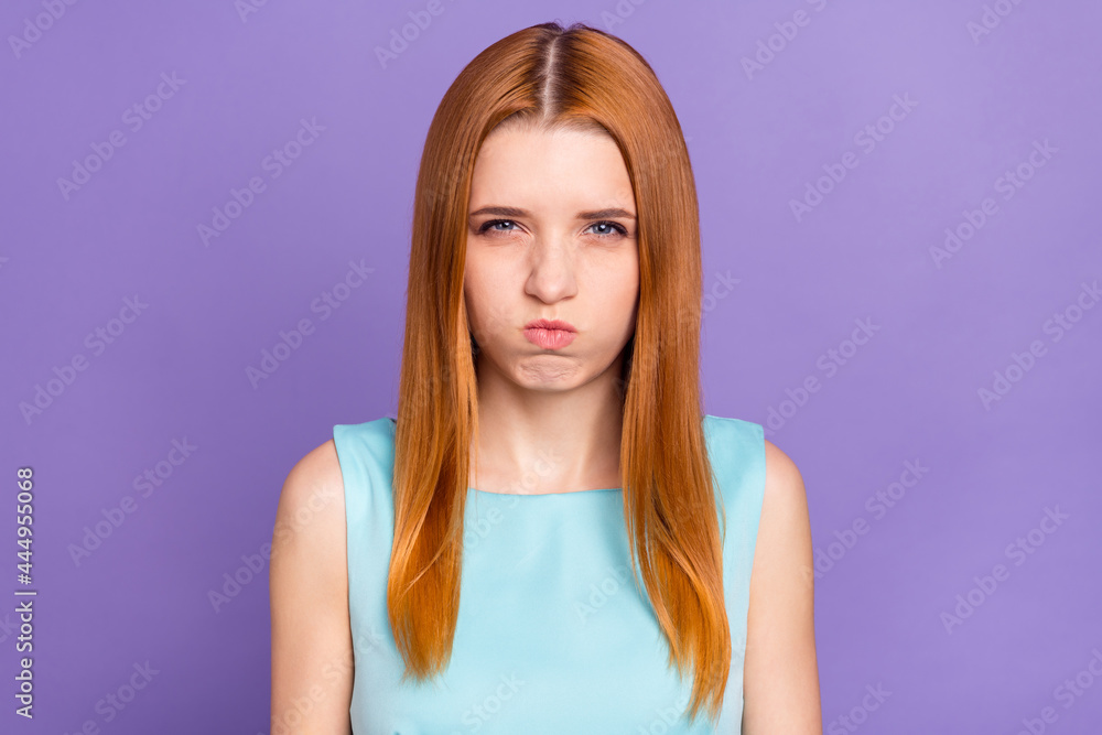 Obraz premium Photo of unhappy upset young woman make grimace face problem offended isolated on purple color background