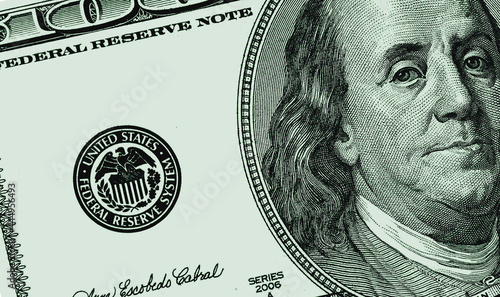 Fragment of one hundred US dollar banknote close up