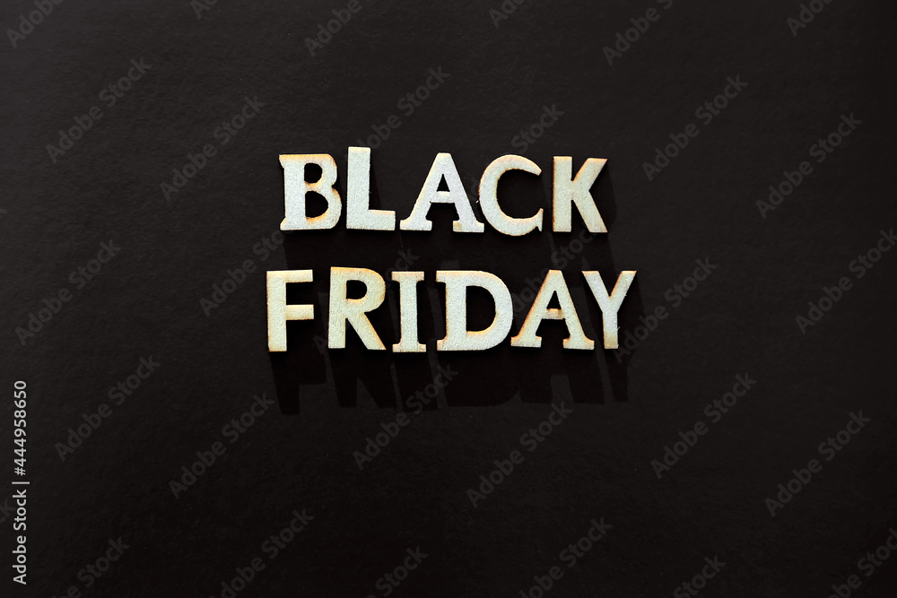 Words black friday. Wooden letters with lettering on top of black background Words black friday. Wooden letters with lettering on top of black background