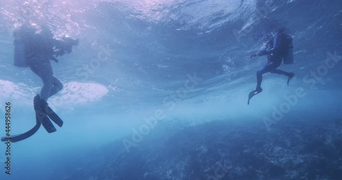 Wallpaper Mural Scuba divers on surface very rough water from underneath. Torontodigital.ca