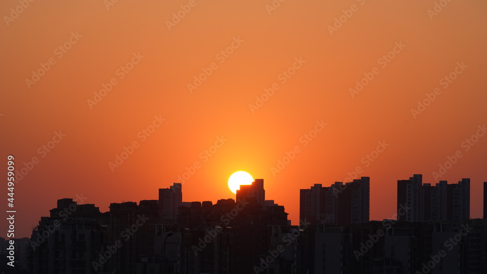 The beautiful sunset view with the buildings and cityscape in the city