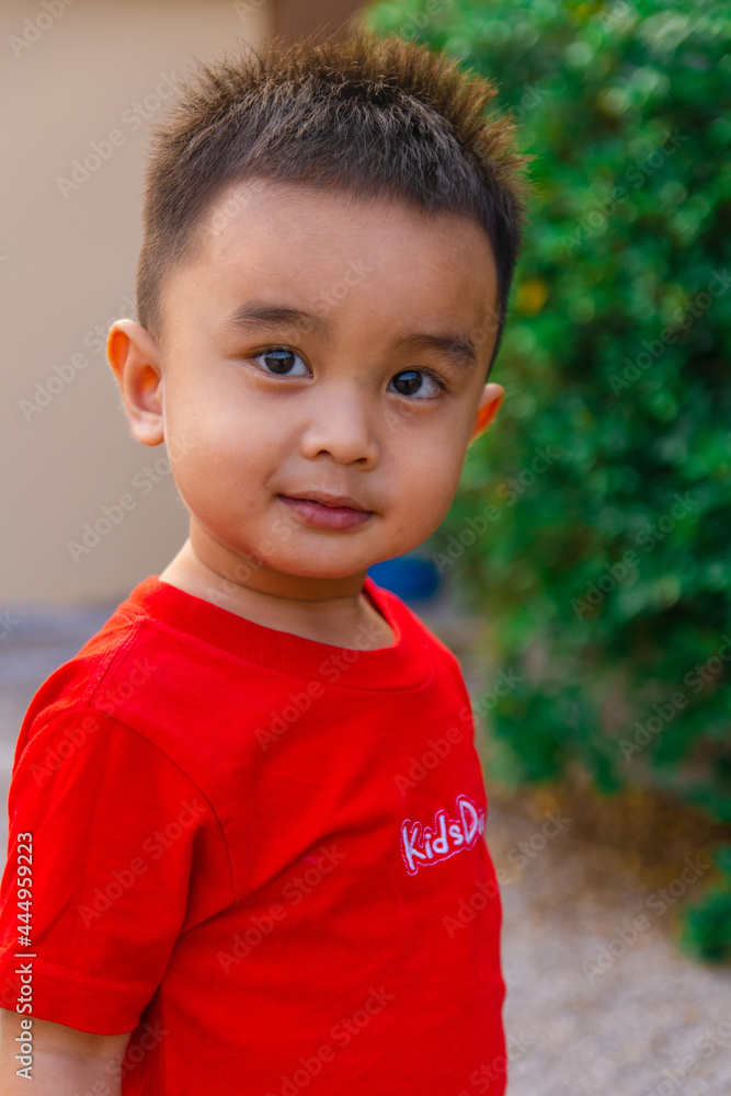 An Asian toddler who was smiling and looking at the camera. portrait of children. An Asian toddler who was smiling and looking at the camera. portrait of children.