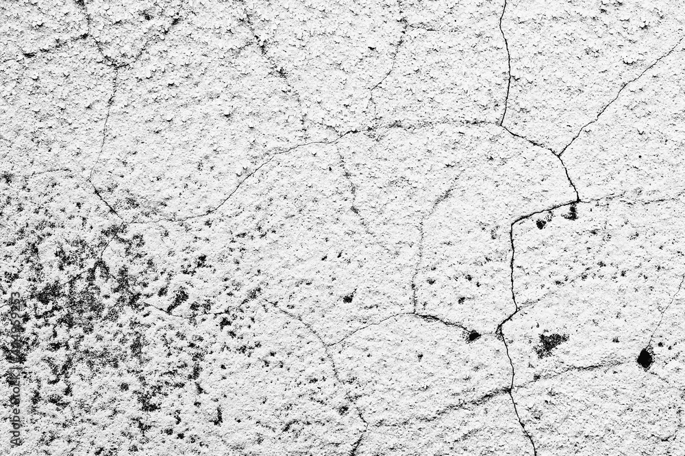 Texture of a concrete wall with cracks and scratches which can be used as a background Texture of a concrete wall with cracks and scratches which can be used as a background