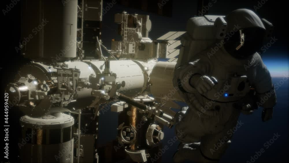 International Space Station and astronaut in outer space over the planet Earth International Space Station and astronaut in outer space over the planet Earth