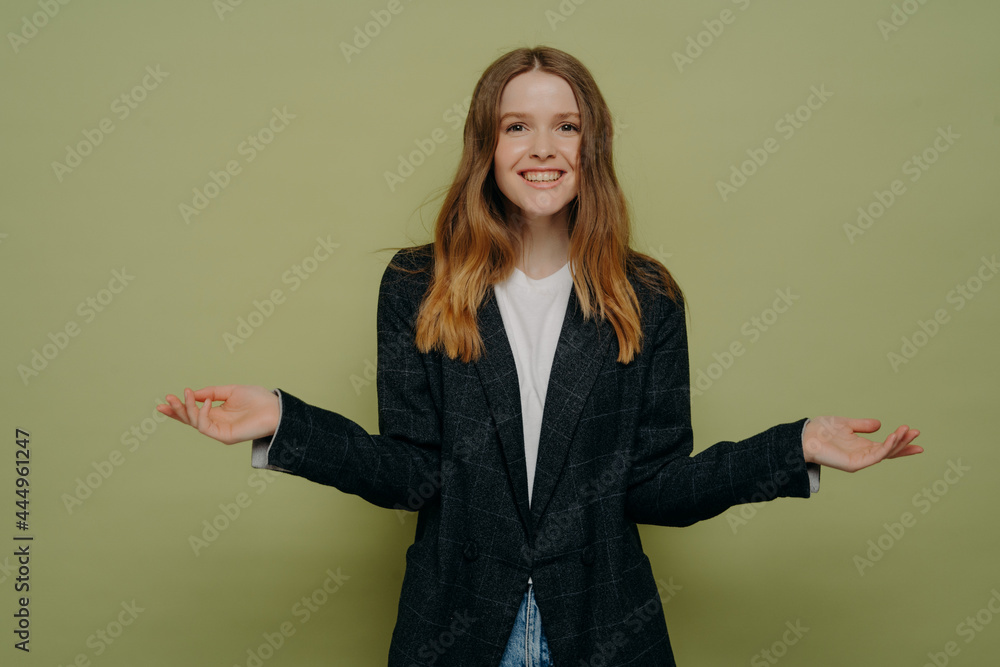 Happy female shrugging shoulders with spreaded hands Happy female shrugging shoulders with spreaded hands