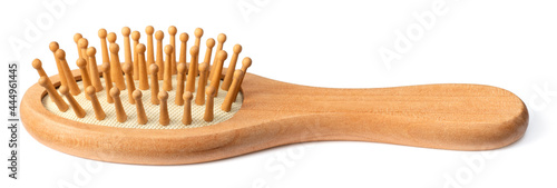 one wooden paddle hairbrush isolated on white