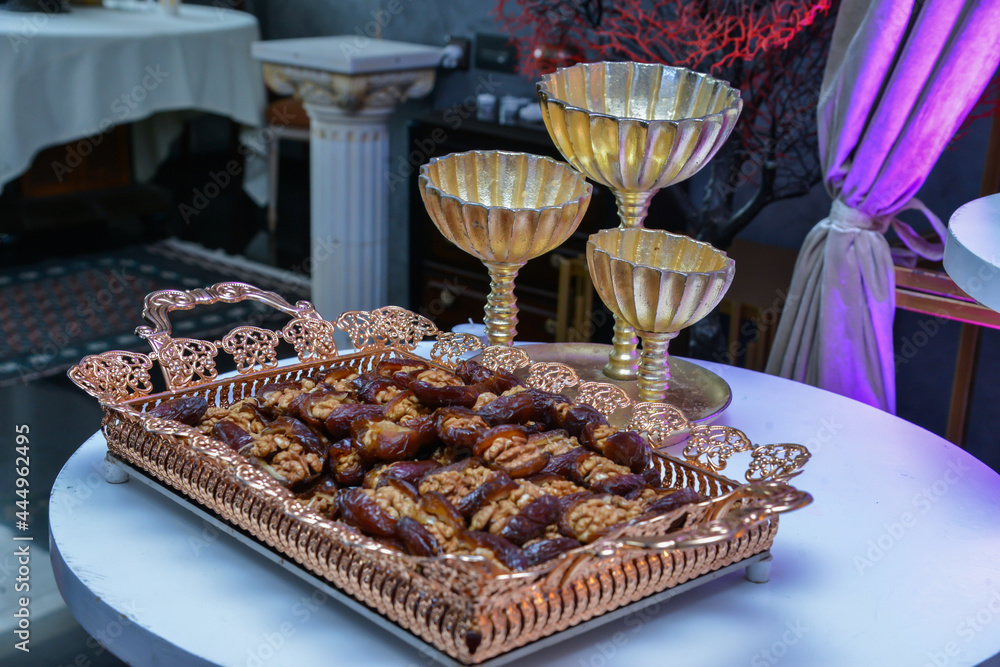 Traditional Moroccan stuffed dates with Dulce de leche and almonds served with milk