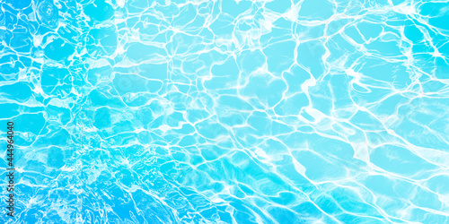 Abstract background like blue seawater with sunlight reflections. Blue banner best for summer design. 