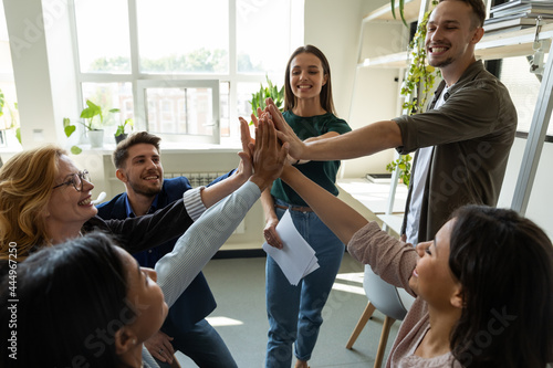 Fotografie Happy motivated professional team celebrating success