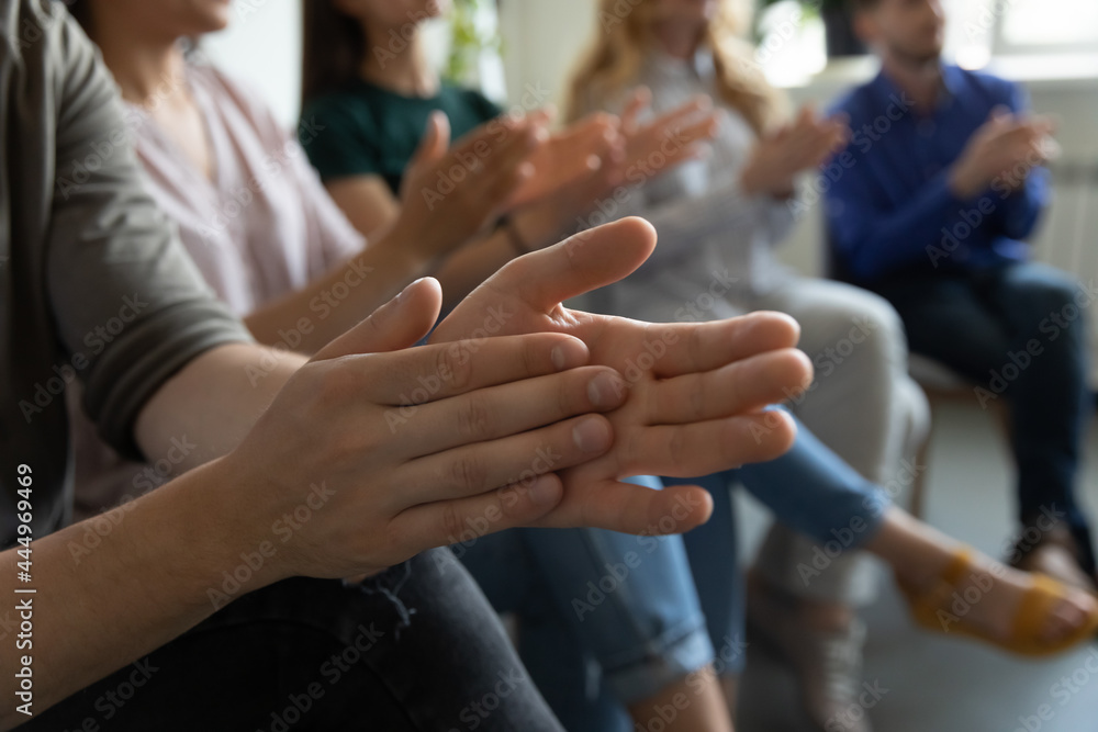 Hands of audience applauding speaker, presenter for speech, presentation, training. Group of employees expressing recognition and acknowledgement to colleague or team leader, clapping hands. Close up Hands of audience applauding speaker, presenter for speech, presentation, training. Group of employees expressing recognition and acknowledgement to colleague or team leader, clapping hands. Close up