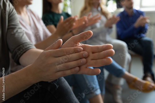 Hands of audience applauding speaker, presenter for speech, presentation, training. Group of employees expressing recognition and acknowledgement to colleague or team leader, clapping hands. Close up
