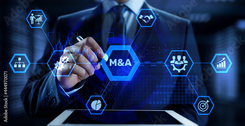M&A Merger and acquisition business finance concept. Businessman pressing button. photo