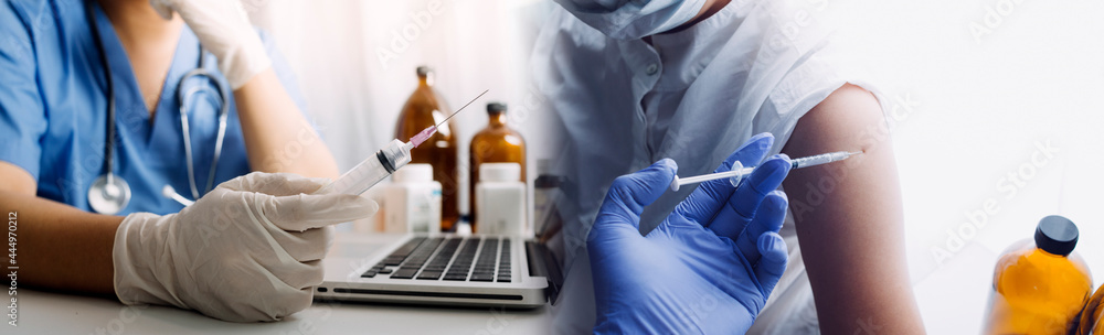 doctor or scientist with a stethoscope holding COVID-19 vaccine, Healthcare And Medical concept, vaccine Concept fight against virus covid-19 corona virus doctor or scientist with a stethoscope holding COVID-19 vaccine, Healthcare And Medical concept, vaccine Concept fight against virus covid-19 corona virus