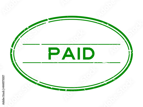 Grunge green paid word oval rubber seal stamp on white background