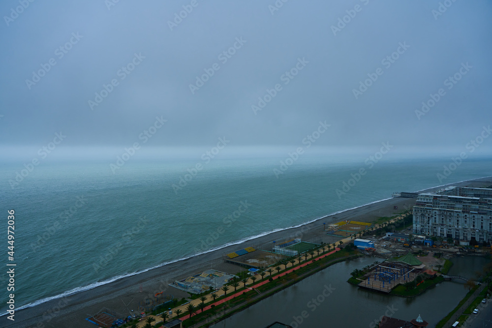 Batumi city beach on a cloudy rainy day