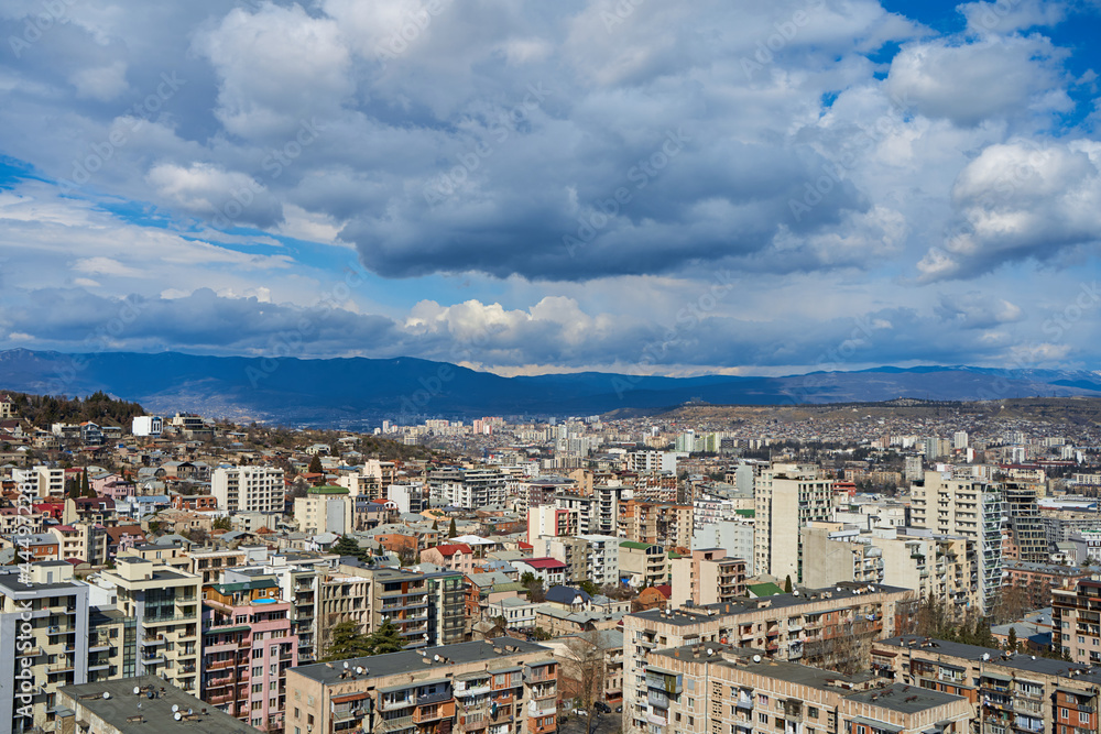 Panorama of a densely populated city. Tbilisi city landscape from above Panorama of a densely populated city. Tbilisi city landscape from above