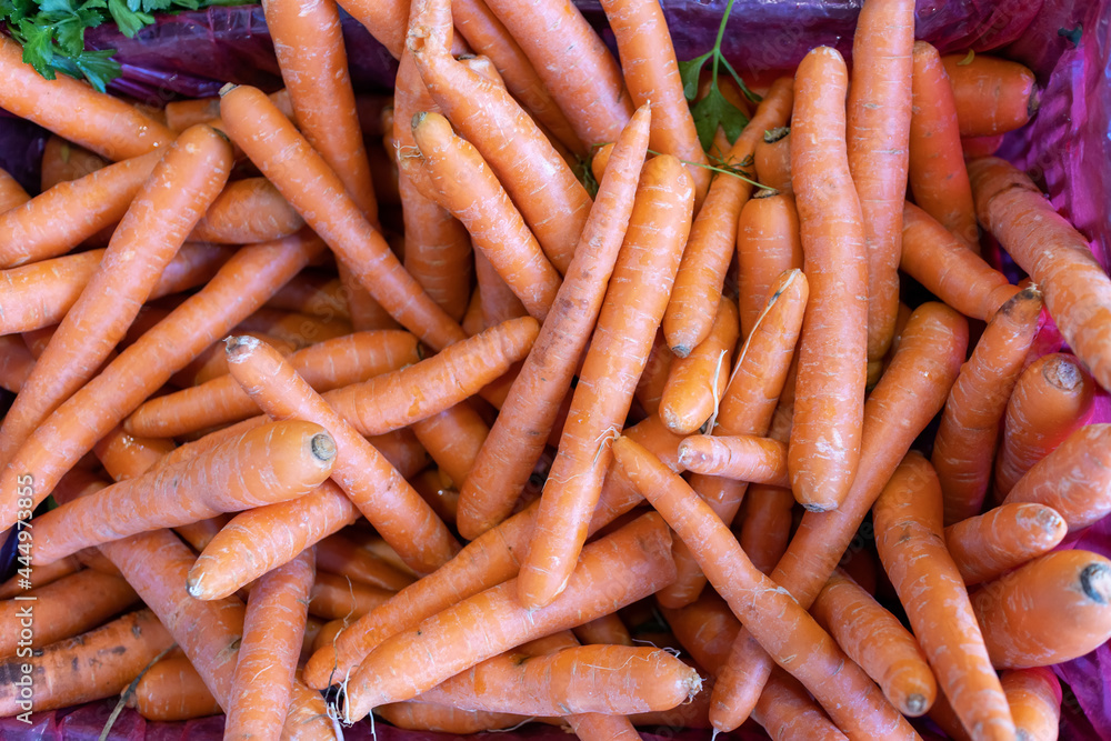 Fresh carrots on the counter of the farmers' market, sale of the harvest. Background image, place for text. Fresh carrots on the counter of the farmers' market, sale of the harvest. Background image, place for text.