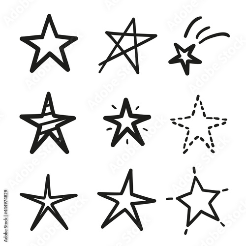 Hand drawn black stars on isolated white background. Black and white illustration © mikabesfamilnaya