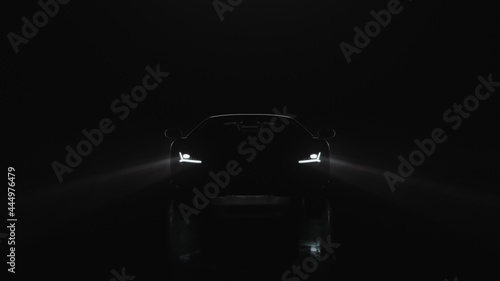 3d render sports car with lights goes to the camera on a black background © davstudio