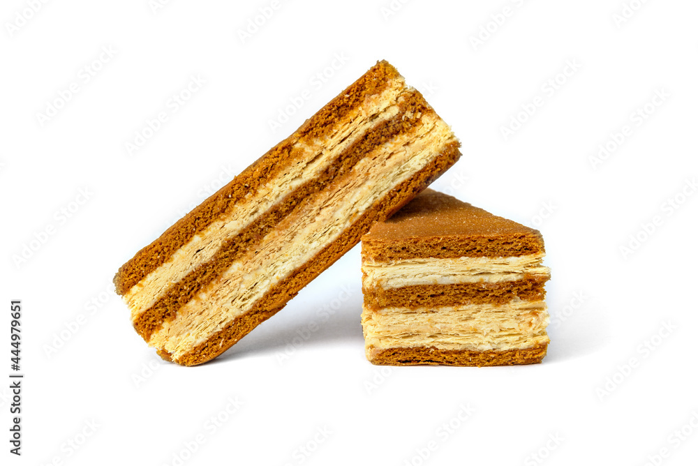 Slice of honey cake isolated on white background. Slice of honey cake isolated on white background.