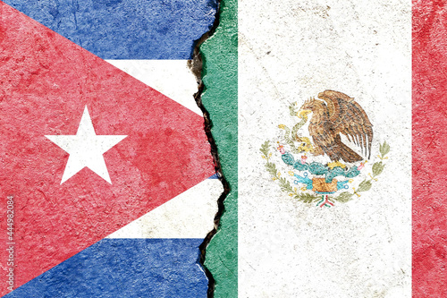 Photography Flags of Cuba and Mexico painted on a weathered broken wall - political conflict