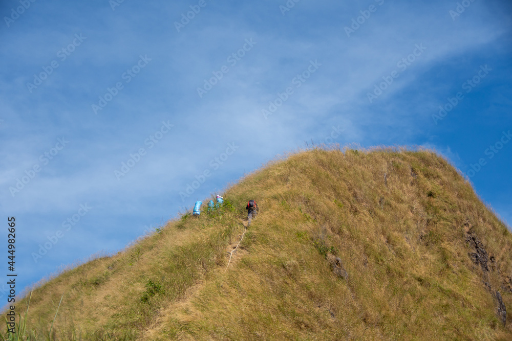 hiking group on mountain at Khao Chang Phuak, Thongphaphoom National Park, Kanchanaburi Province, Thailand. Subject is blurred, noise and color effect. hiking group on mountain at Khao Chang Phuak, Thongphaphoom National Park, Kanchanaburi Province, Thailand. Subject is blurred, noise and color effect.
